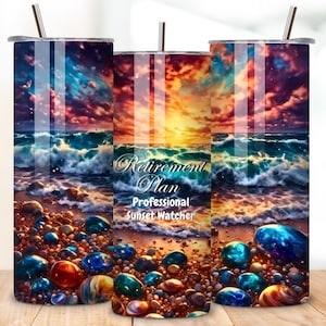 May include: A stainless steel tumbler with a colorful sunset scene over the ocean. The tumbler has the text "Retirement Plan Professional Sunset Watcher" printed on it.