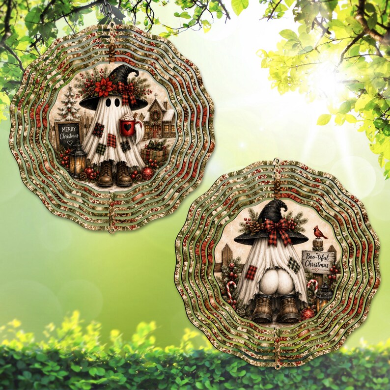 May include: Two round metal wind spinners featuring a ghost character wearing a witch hat and boots. The left spinner shows a ghost holding a red mug with the text Merry Christmas. The right spinner shows a ghost with the text Boo-tiful Christmas.