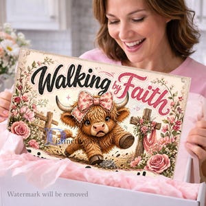 May include: A rectangular sign featuring the text Walking by Faith in black and pink script. The illustration depicts a brown Highland cow wearing a pink floral bow, standing near a wooden cross surrounded by pink roses and green foliage.