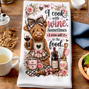May include: White kitchen towel with a whimsical design featuring a Highland cow holding a wine glass. The towel has the text "I cook with wine. Sometimes I even add it to the food." and other kitchen-themed illustrations.