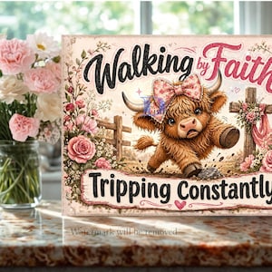 May include: A rectangular sign featuring a brown Highland cow with a pink floral bow, a wooden cross, and pink roses. The text reads Walking by Faith Tripping Constantly in black and pink script and block lettering against a light background.