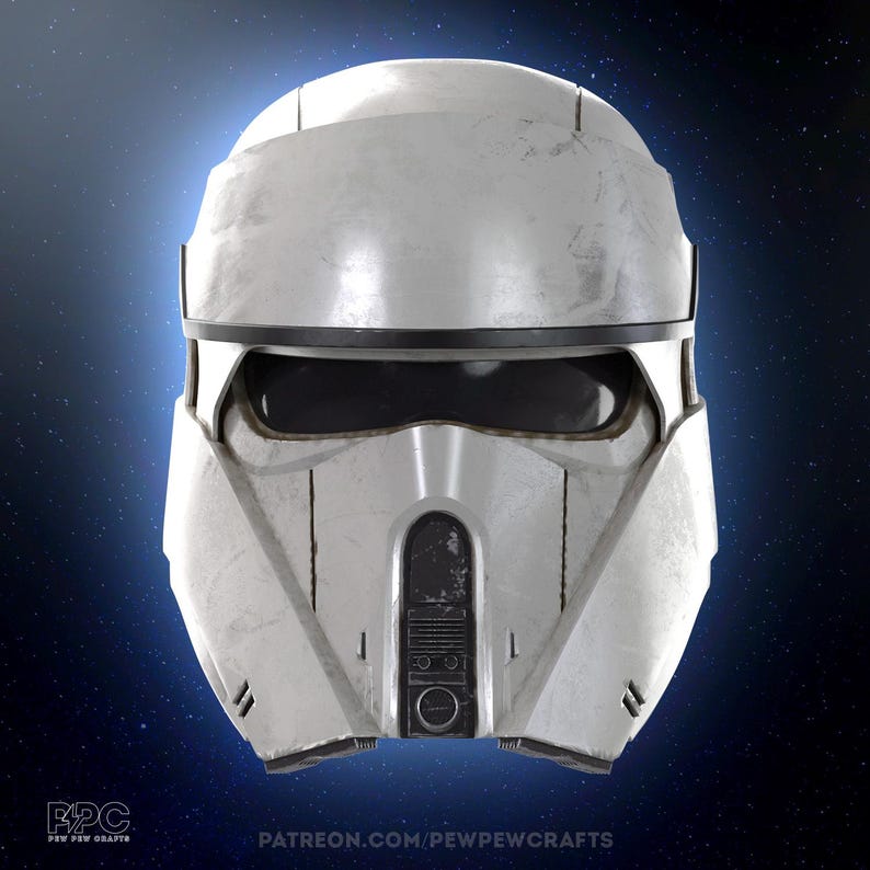 May include: A weathered white and silver helmet with a black visor and accents. The helmet has a rounded top and a detailed front panel with a circular design. The image includes the text "PATREON.COM/PEWPEWCRAFTS".