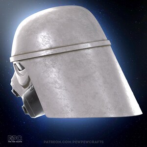 May include: A side view of a weathered, off-white helmet with a distinctive design. The helmet features a rounded top, a horizontal band, and a detailed face mask with a dark gray respirator. The image has the text "PEW PEW CRAFTS" and "PATREON.COM/PEWPEWCRAFTS".