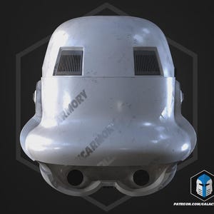 May include: A weathered white Stormtrooper helmet. It has two rectangular vents above the eye openings and two circular openings below. The text "ARMORY" is printed on the helmet. The overall design suggests a sci-fi theme.