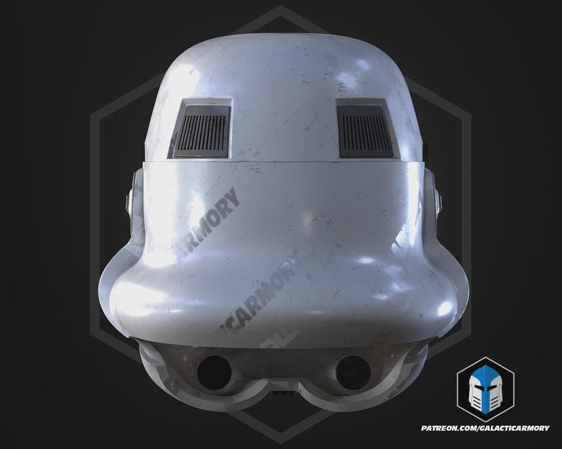 May include: A weathered white Stormtrooper helmet. It has two rectangular vents above the eye openings and two circular openings below. The text "ARMORY" is printed on the helmet. The overall design suggests a sci-fi theme.