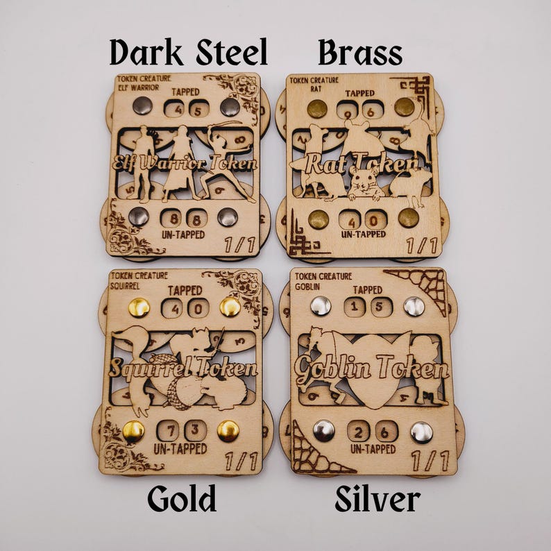 May include: Four wooden token counters with different creature designs. The counters are labeled "Elf Warrior Token", "Rat Token", "Squirrel Token", and "Goblin Token". Each counter has a dial with a tapped and untapped side, and a number of beads to represent the creature's power. The counters are available in four different finishes: dark steel, brass, gold, and silver.