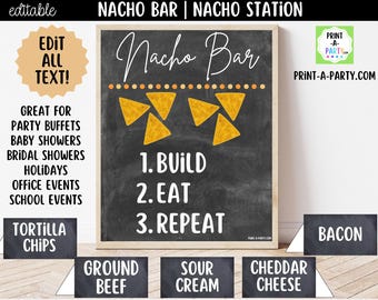 May include: A chalkboard-style sign for a nacho bar, featuring the words "Nacho Bar" in elegant script. The sign includes instructions: "Build, Eat, Repeat," and is decorated with tortilla chips. Additional signs list toppings: tortilla chips, ground beef, sour cream, cheddar cheese, and bacon.