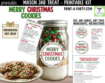 May include: A mason jar kit for making Merry Christmas Cookies. The jar is filled with ingredients and topped with red, green, and white candies. A plate of baked cookies sits in front of the jar. The kit includes labels, gift tags, and instructions.