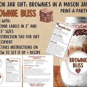 May include: A mason jar gift set for making brownies, labeled "Brownie Bliss." The jar contains layered ingredients and is adorned with a tag and a round label. The set includes labels in 2" and 2.5" sizes, an instruction tag, and recipe details.