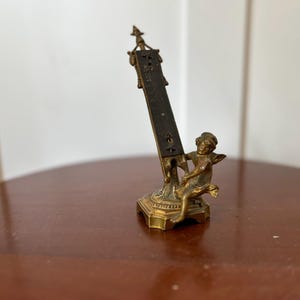 Antique Winged Cherub or Putti Desk Thermometer: An Antique Victorian Bronze Display Piece