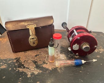 Vintage Abu Sweden Ambassadeur 5000 Red Fishing Reel with Original Case - Collectible Fishing Tackle