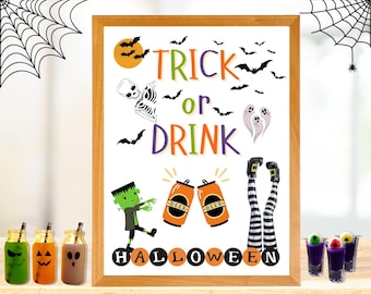 May include: A framed sign with the text TRICK or DRINK and HALLOWEEN, featuring illustrations of a skeleton, ghosts, bats, a green monster, two orange beer cans, and striped witch legs, surrounded by three small jars and three shot glasses.