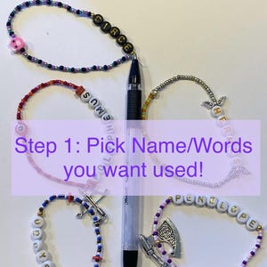 May include: Five beaded bracelets featuring letter beads spelling Circe, Polyphemus, Hermes, Odysseus, and Penelope, alongside various charms including a pig, wings, a bow, and an axe, arranged around a black pen with text overlay Step 1: Pick Name/Words you want used!