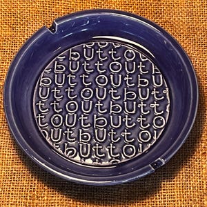 ASHTRAY “BUTT OUT” Whiye Raised Letters on Cobalt Blue Background 6.25” Diameter Made in usa California Pottery AA2 Like New Adorable Funny