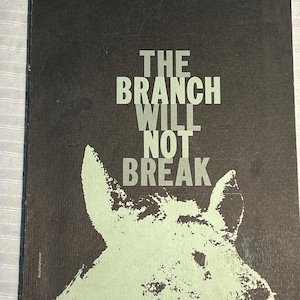 May include: A vintage book cover with the title "THE BRANCH WILL NOT BREAK" in large, white, sans-serif font. The cover is dark gray with a light green illustration of a horse's head. The author's name, James Wright, is at the top.