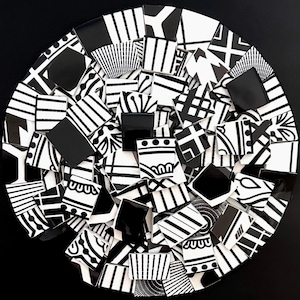 May include: A circular mosaic composed of numerous black and white tiles. Each tile features a unique geometric pattern, including stripes, dots, and abstract shapes. The mosaic is set against a black background, creating a striking contrast.