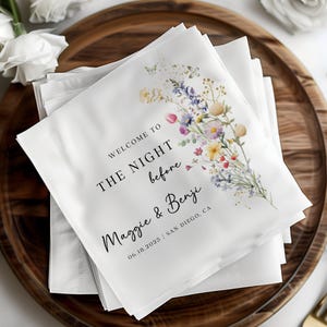 May include: White napkins with a floral design and the text "Welcome to the night before Maggie & Benji 06.18.2025 | San Diego, CA"