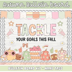 May include: An Autumn Bulletin board kit featuring a white wood-grain background with a pastel bunting banner. The text reads TACKLE YOUR GOALS THIS FALL. Decorative elements include pumpkins, a basket of apples, megaphones, and stars.