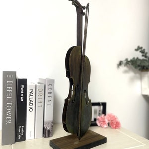 This is 3D metal violin sculpture.Sutable stand on the desk with perfect size. 100% handmade art. Meterial in iron and acrylic pigment .it is good idea for home decor.