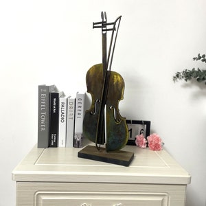 3D Metal Violin statue from 3DmetallicArt Shop.   This violin is handmade and handpainted.Sutable for your house decoration with perfect size. Be painted in rustic color .Meterial in Iron and acrylic pigment .It is good idea for friend gift.