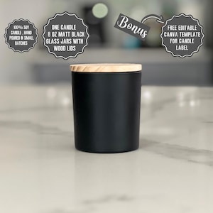 May include: An 8 oz matte black glass candle jar with a light-colored wood lid. Text overlays include: 100% SOY CANDLE, HAND POURED IN SMALL BATCHES, ONE CANDLE 8 OZ MATT BLACK GLASS JARS WITH WOOD LIDS, Bonus, and FREE EDITABLE CANVA TEMPLATE FOR CANDLE LABEL.