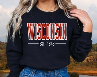 May include: A black sweatshirt with a red "WISCONSIN EST. 1848" graphic print.