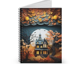 May include: Spiral-bound notebook featuring a spooky Halloween-themed illustration. The cover art depicts a haunted house with glowing windows, surrounded by autumn foliage, a full moon, and two yellow orbs in the sky. The notebook has white lined pages.
