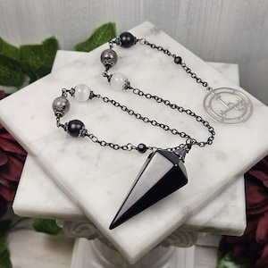 Lilith pendulum, dowsing, scrying, divination tool, made with onyx, larvakite and selenite