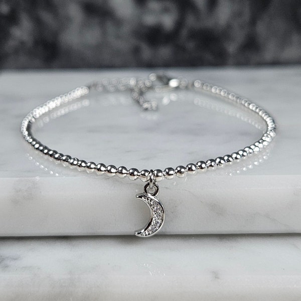 Artemis single charm minimalist bracelet with mini pave crescent moon with clear cz stones. A part of the Tiny Treasures collection.