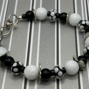 Black and White Polka Dot Daisy Bracelet featuring White Jade Stone, Black jasper, and Lampwork Beads