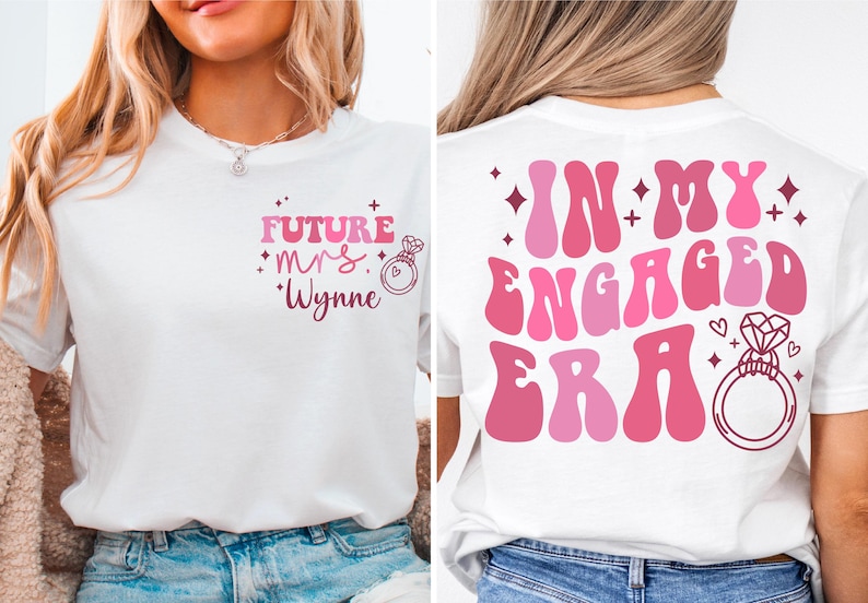 May include: Two white t-shirts with pink text and graphics. The front shirt says "Future Mrs. Wynne" with a pink ring and diamond graphic. The back shirt says "In My Engaged Era" with a pink ring and diamond graphic.