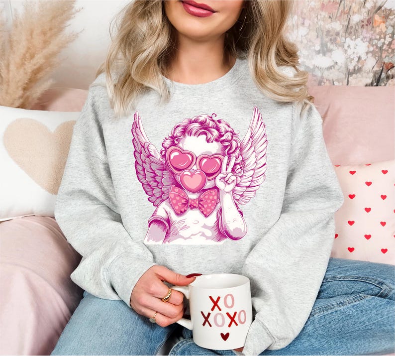 a woman sitting on a couch holding a coffee mug