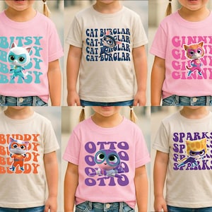 The image is a collage of six children's t-shirts featuring cartoon cat characters.