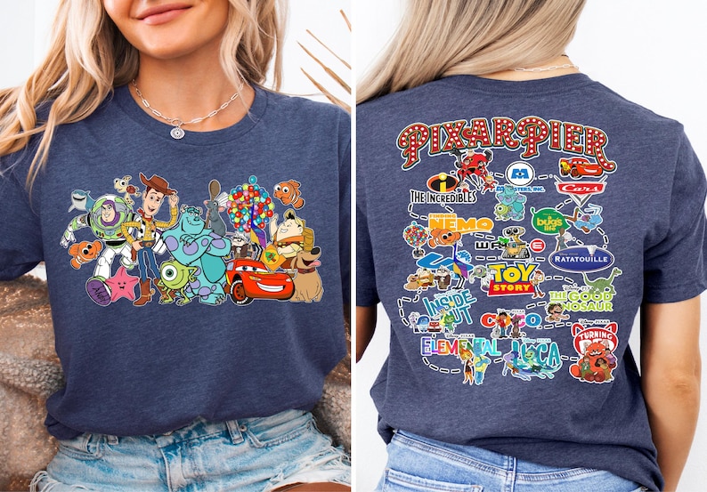 a woman wearing a blue tshirt with cartoon characters on it