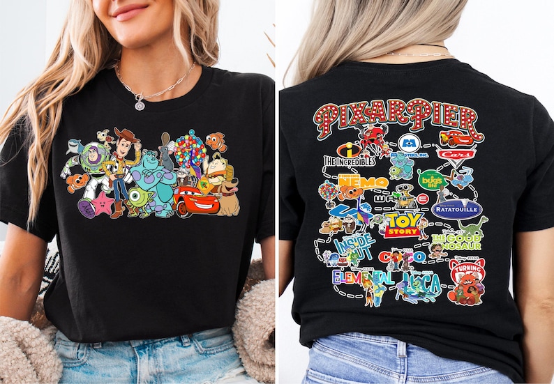 a woman wearing a black shirt with cartoon characters on it
