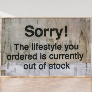 May include: A framed sign with a distressed, textured background. The sign reads "Sorry! The lifestyle you ordered is currently out of stock."