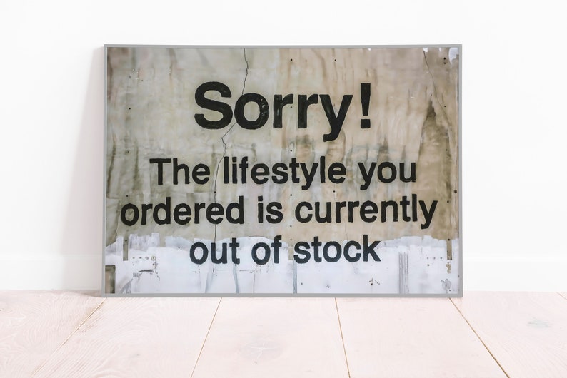 May include: A distressed, white sign with black text that reads "Sorry! The lifestyle you ordered is currently out of stock."