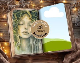 May include: A vintage book with a fairy illustration on the left page and a green landscape on the right page. The book is open and has a brown leather cover. The book is surrounded by fairy lights and a wooden background. The book has a label that says "Fairy Lights 28 Journal MockUps".