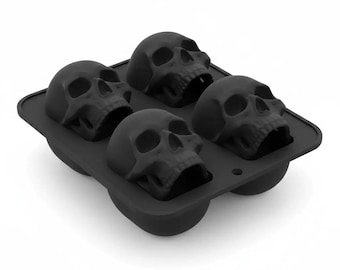 Molde de silicona negro con forma de calavera para hielo y repostería.