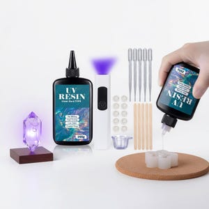 May include: A UV resin crafting kit including two 250g bottles of clear hard type resin, a white UV curing lamp, five plastic droppers, five wooden stir sticks, ten small circular silicone molds, and one small silicone mixing cup.