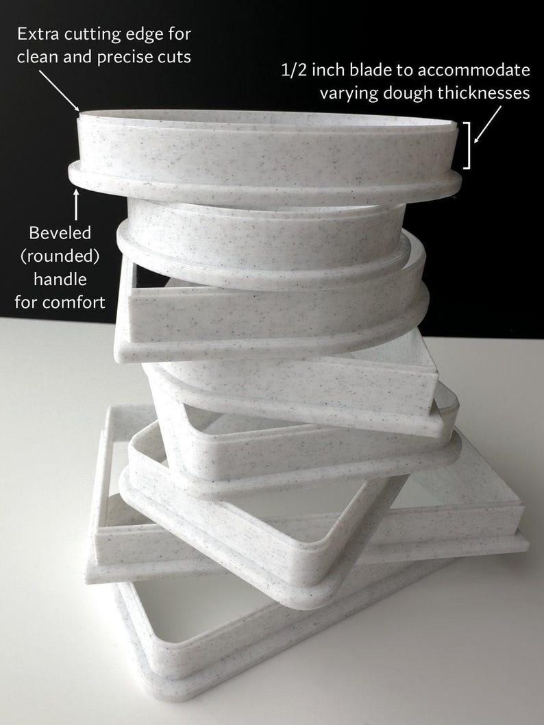 a stack of white plates sitting on top of a table