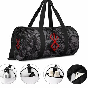May include: A black and grey duffel bag featuring a red graphic. It has black handles and a shoulder strap. The bag includes multiple pockets, such as a side pocket with a water bottle, a pocket with a phone, and a pocket with toiletries.