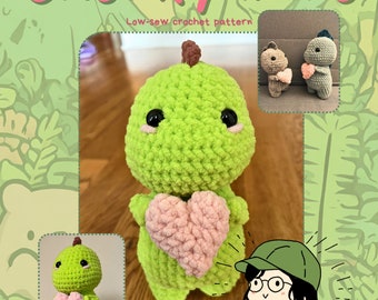 May include: A crochet pattern for a chunky green dinosaur holding a pink heart. The pattern is called "Chunky Dino" and is a low-sew crochet pattern. The image also shows a smaller version of the dinosaur and a cartoon illustration of a person holding a dinosaur.