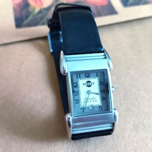 Street Collection Piccadilly Opera wristwatch, rectangular case silver tone, black leather strap, Art Deco look, vintage unisex quartz