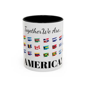 May include: A white ceramic mug with a black handle and the text "But First, Coffee" in a bold, black font. The mug is set against a blurred background, suggesting a cozy setting.