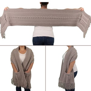 May include: A gray knitted scarf with fringe on the ends. The scarf has two pockets on the front.
