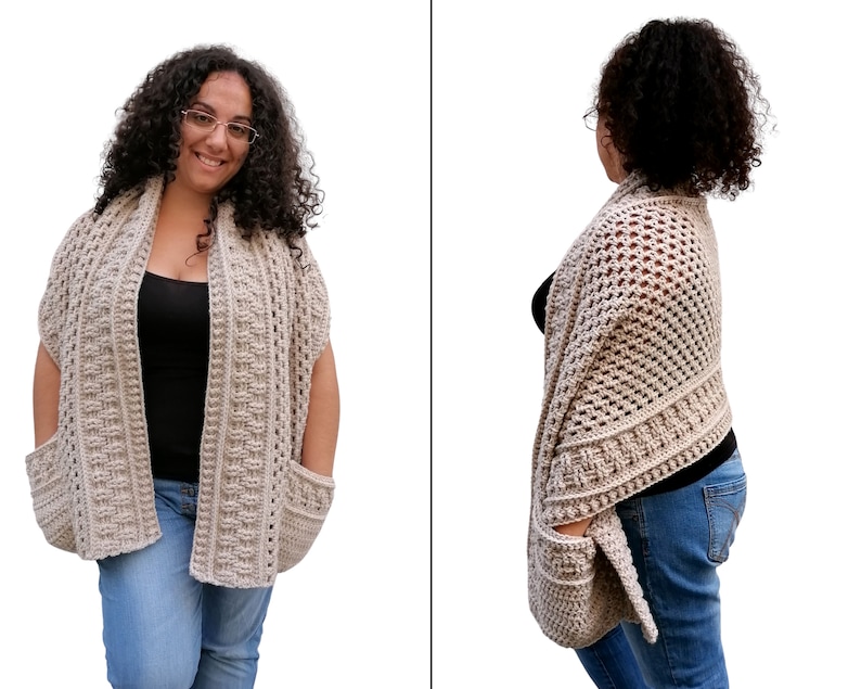 May include: A beige crochet shawl with pockets. The shawl is open in the front and has a loose, flowing fit.