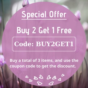 May include: A pink circle with white text that reads "Special Offer Buy 2 Get 1 Free Code: BUY2GET1 Buy a total of 3 items, and use the coupon code to get the discount."