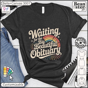 May include: Dark gray unisex t-shirt with the text "Waiting for the Big Beautiful Obituary" in a retro font, featuring a rainbow design. The shirt is from Bella+Canvas 3001 and is customizable.