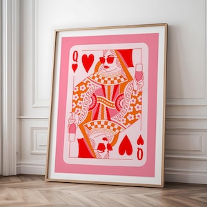 May include: A pink and red illustration of the Queen of Hearts playing card. The Queen is wearing sunglasses and holding a glass of champagne. The card has a decorative border with a floral pattern.